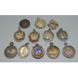 A collection of twelve silver fob medals; five swimming medals, two water polo, four ballroom