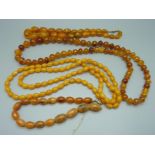 Four amber coloured bead necklaces