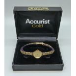 A lady's 9ct gold wristwatch on a 9ct gold bracelet by Accurist, total weight with movement 11.3g