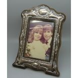 A silver photograph frame, height 21cm