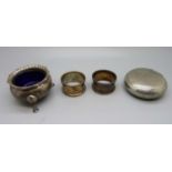 Two silver napkin rings, a silver salt, (119g of silver), and a tobacco box