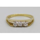 An 18ct gold, three stone diamond ring, 2.7g, M