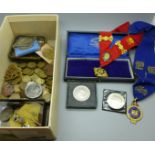 A collection of coins, medallions and badges