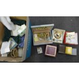 A box of costume jewellery, two autograph books, two christening sets, compact, etc.