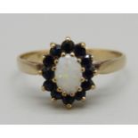 A 9ct gold cluster ring set with sapphire and opal, 1.6g, M