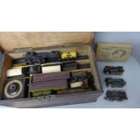 A small wooden chest containing Trix TTR model rail including four locomotives, one tender, three
