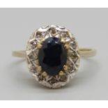 A 9ct gold ring set with a sapphire and diamonds, 2.8g, P