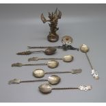 Six spoons marked 800, one other spoon with pagoda detail, a fork with giraffe finial, a model of