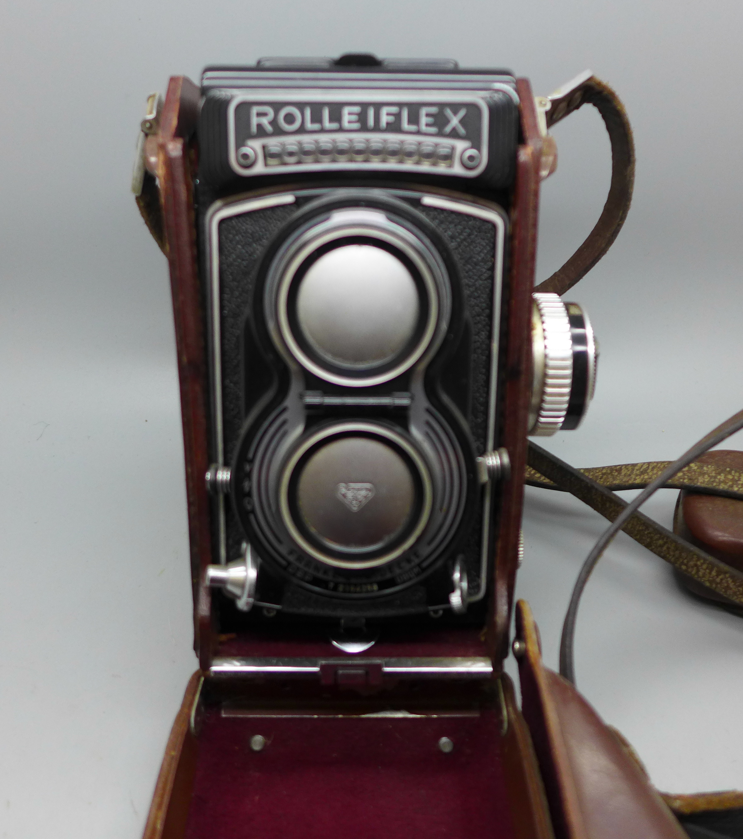 A Rolleiflex Franke & Heidecke TLR camera with leather case, numbered T2164258