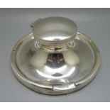 A large silver Capstan inkwell, worn Birmingham hallmark, diameter of base 17.5cm