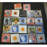 Thirty-one 1960's, rock n roll and other 7" singles and EP's, including Elvis Presley, Travis and