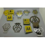 A collection of vintage AA car badges, including pre-war, one numbered 36154L