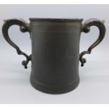 A 17th Century two handled tankard, a/f, with worn inscription, 'At The Man And Scythe Sacred to The