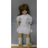 An Armand Marseille bisque head doll with composition body, 60cm