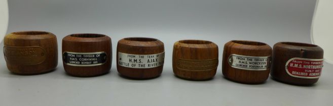 Six napkin rings made from timber and teak recovered from Royal Navy vessels