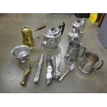 A plated tea pot and water jug, two tankards, brass nutcrackers and flatware **PLEASE NOTE THIS
