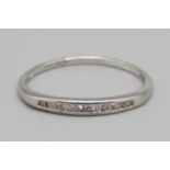 A platinum set nine stone diamond ring, 1.8g, P