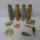 Four military shell cases, etc.