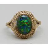 A 9ct gold and cabochon black opal ring, 3.4g, M