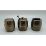 A three piece silver condiment set in the form of barrels, Birmingham 1902, 113g, two with blue