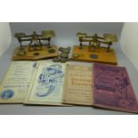 Two sets of postal scales and weights and early 20th Century stamp price guides