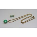 A pair of 9ct gold and emerald set earrings with a 9ct gold chain and 9ct gold mounted emerald