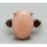 A silver gilt, coral coloured cabochon and red stone ring, V