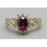 A 9ct gold cluster ring set with diamonds and a ruby, 3.2g, N