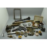 A small silver photograph frame, (requires back), assorted regimental badges, other badges, a silver