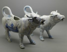 A pair of Delft cow creamers, one a/f, 25.5cm