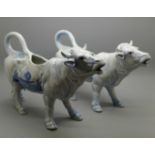 A pair of Delft cow creamers, one a/f, 25.5cm