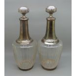 A pair of French silver mounted glass bottles, 25.5cm, (glass inside the neck a/f)