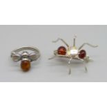 A silver and amber bee ring and a bug brooch