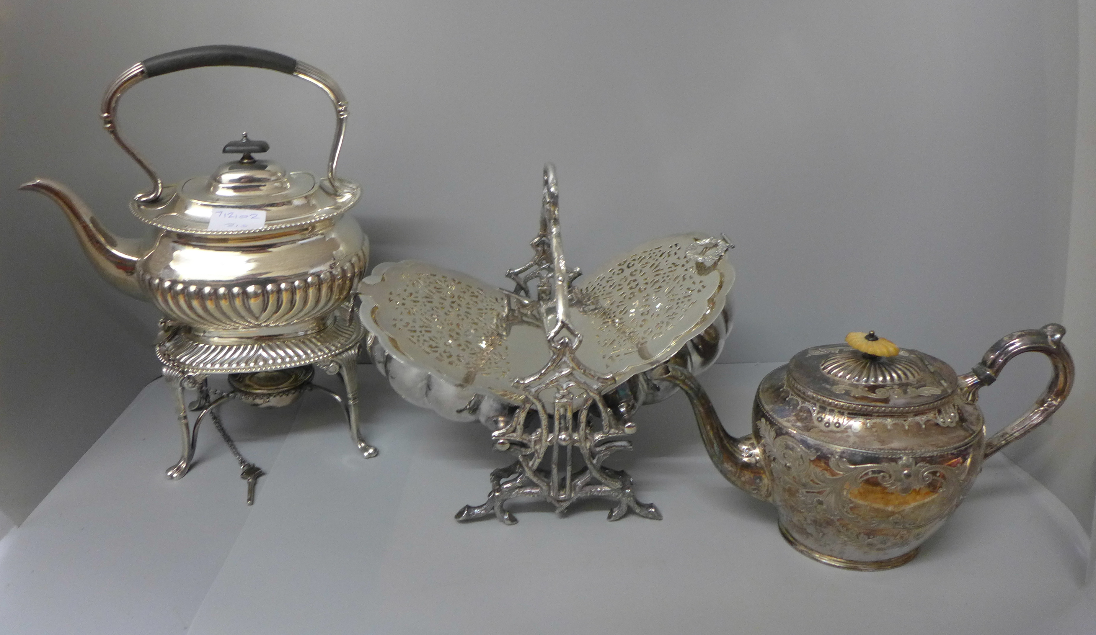 A plated tea pot, a plated spirit kettle, and a plated serving dish