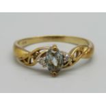 A 9ct gold ring set with a blue stone and diamonds, 2.4g, R