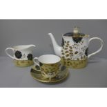 A Royal Crown Derby Kimono tea pot, milk jug, cup and saucer, tea pot, second