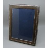 A silver photograph frame, 17cm x 22cm