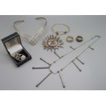 Silver jewellery including a torc necklace, ring, bangle, etc., and one other white metal brooch and