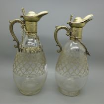 A pair of 19th Century cut glass spirit decanters with plated tops, and Whisky, Gin and Brandy
