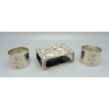 Two heavy silver napkin rings, personalised, 127g, and a silver matchbox holder, a/f, 51g