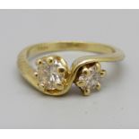 An 18ct gold crossover diamond ring, approximately 0.70ct diamond weight, 3g, K