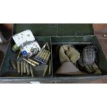 A military tin with dummy hand grenade, a gas mask canvas case, canvas belts, regimental patches,