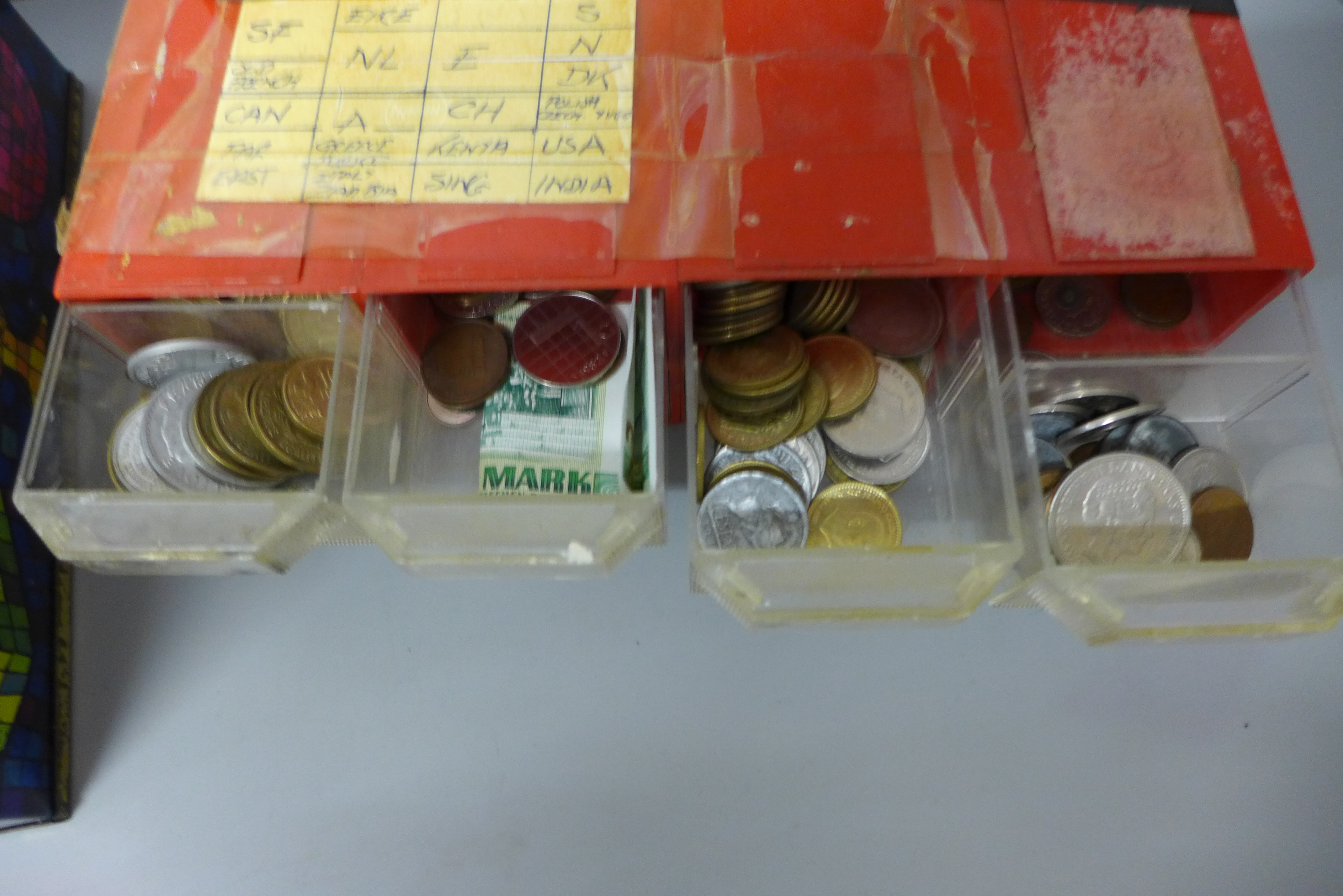 An eight drawer plastic cabinet with sorted foreign coins and a tin of coins - Image 2 of 3