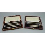 Two sets of four silver whist pencils, cased