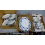 A blue, white and gold china dinner service and four large serving plates **PLEASE NOTE THIS LOT