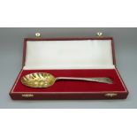 A silver berry spoon, Sheffield 1991, cased, 76g