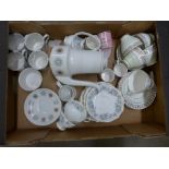 A box of tea wares, Royal Albert Silver Maple, Imperial bone china, Myott Constellation, and Rosanna