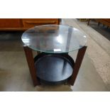 A teak and glass topped circular coffee table