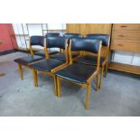 A set of six teak and black vinyl dining chairs