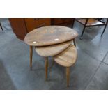 An Ercol elm and beech pebble shaped nest of tables